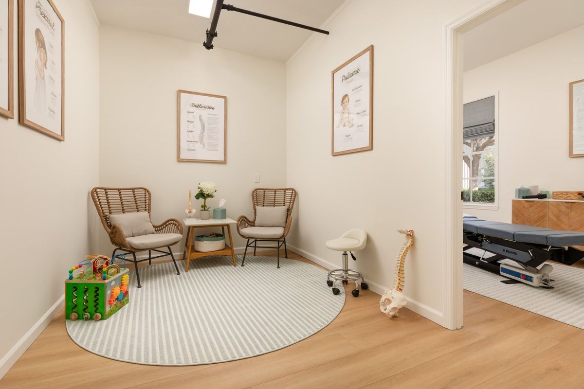 A consulting room with two chairs and toys for the kids